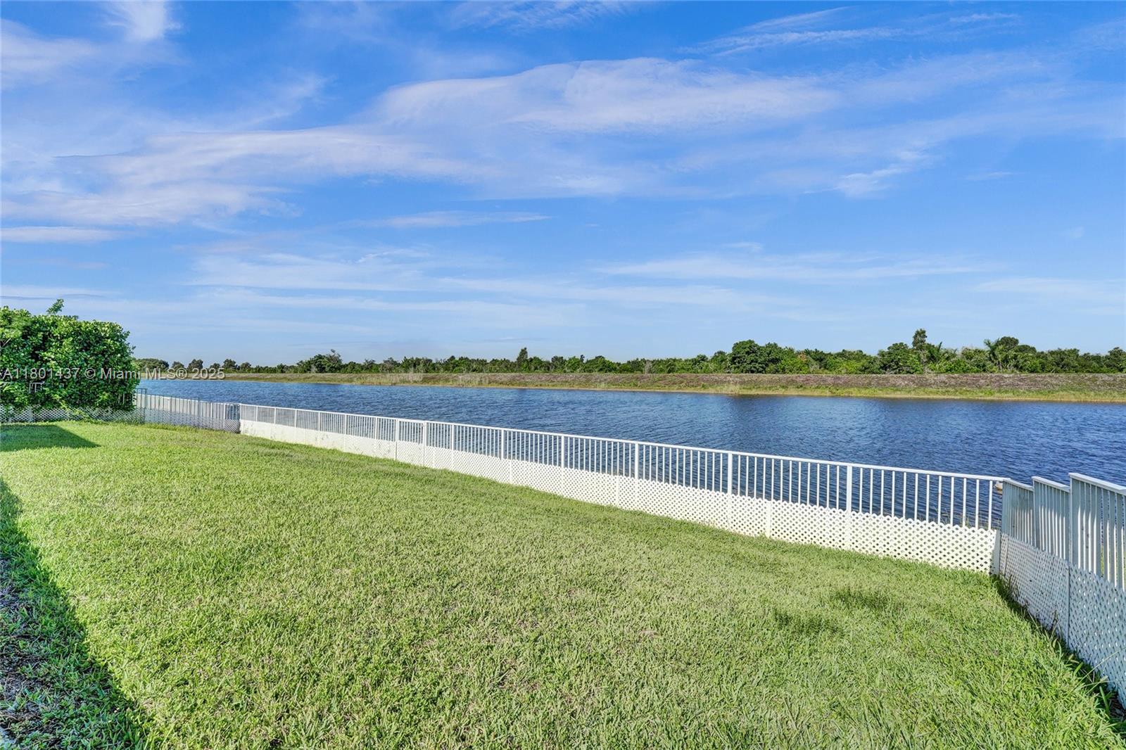 3360 Southwest 195th Terrace Miramar, FL 33029 - Photo 9 of 65 a view of a garden with lake and houses in the back