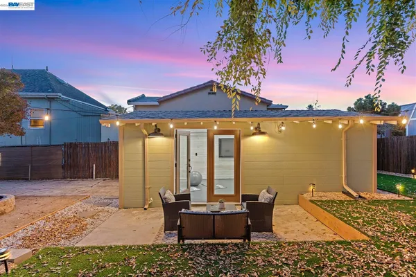 a view of a couches and dinning table in patio