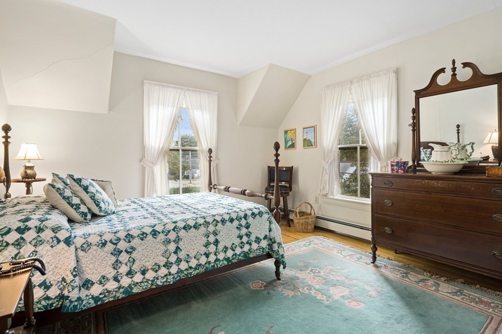 39 Summer Street Danvers, MA 01923 - Photo 23 of 46 a bedroom with a bed wooden floor and window