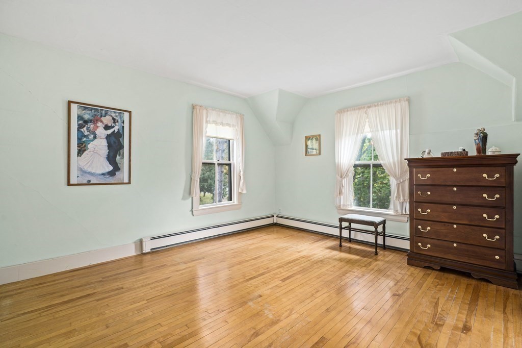 39 Summer Street Danvers, MA 01923 - Photo 25 of 46 a view of a bedroom with furniture and wooden floor