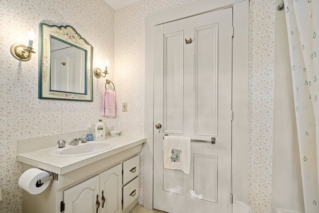 39 Summer Street Danvers, MA 01923 - Photo 31 of 46 a bathroom with a sink vanity and a mirror