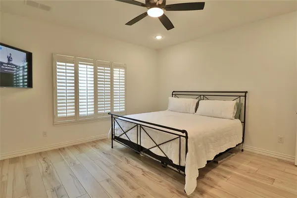 a bedroom with a bed and window