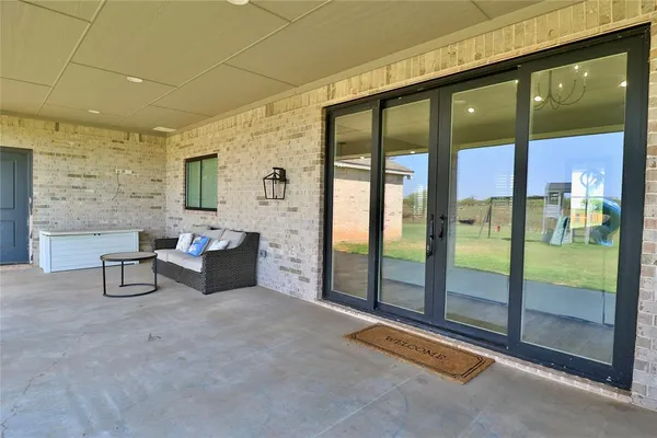 a view of a lobby with furniture and floor to ceiling window