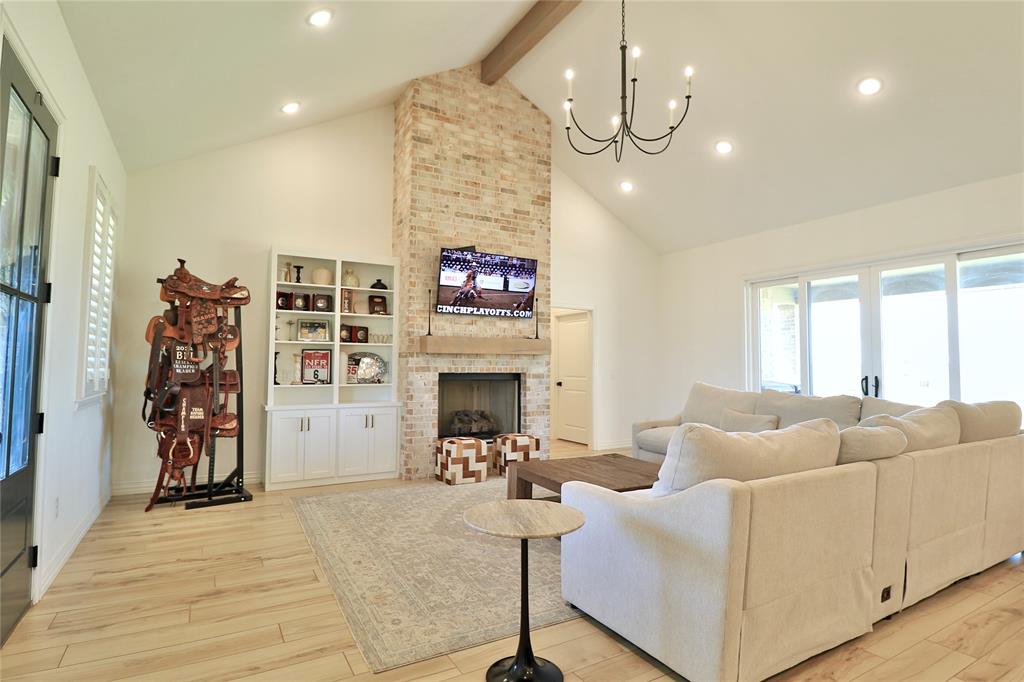 2610 Weetu Road Iowa Park, TX 76367 - Photo 8 of 35 a living room with furniture and a fireplace
