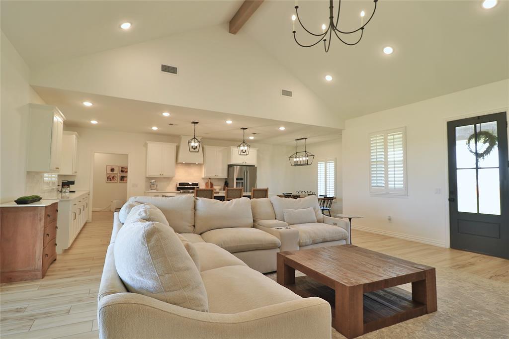 2610 Weetu Road Iowa Park, TX 76367 - Photo 10 of 35 a living room with couches and kitchen view with wooden floor