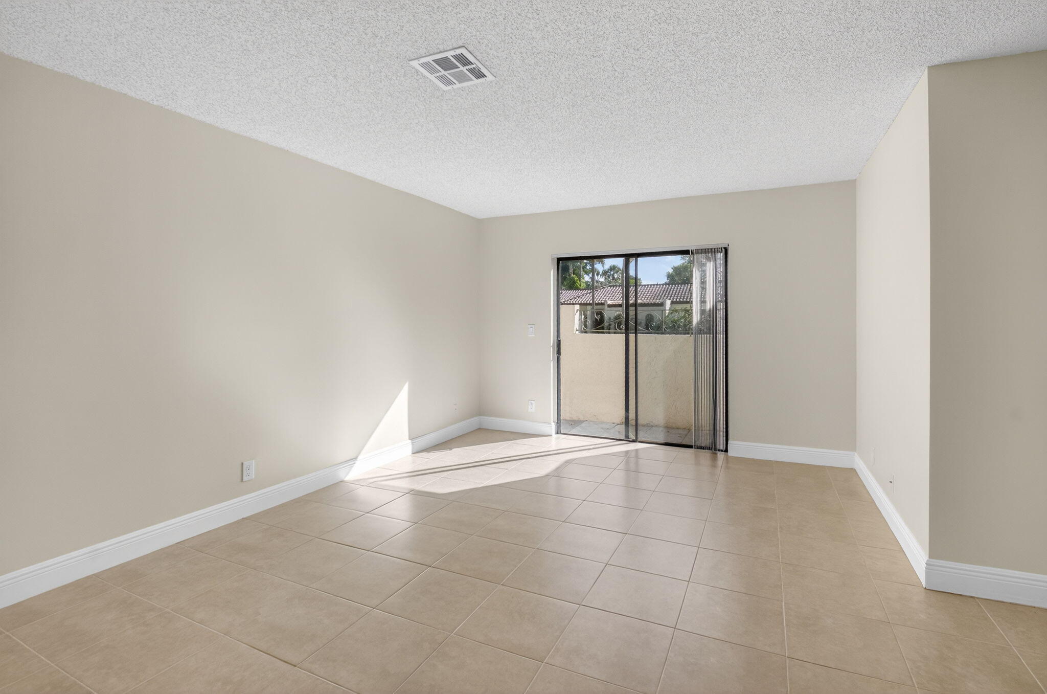3143 Kingswood Terrace, Unit 3143 Boca Raton, FL 33431 - Photo 19 of 66 an empty room with windows and closet