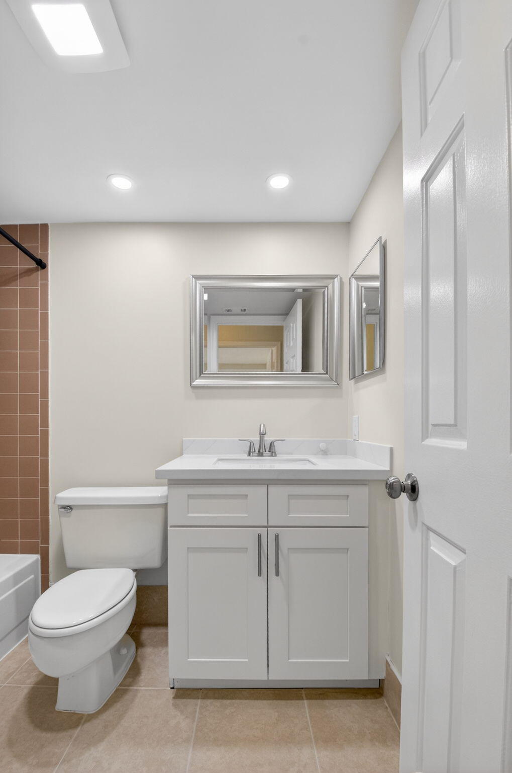 3143 Kingswood Terrace, Unit 3143 Boca Raton, FL 33431 - Photo 29 of 66 a bathroom with a toilet a sink and mirror