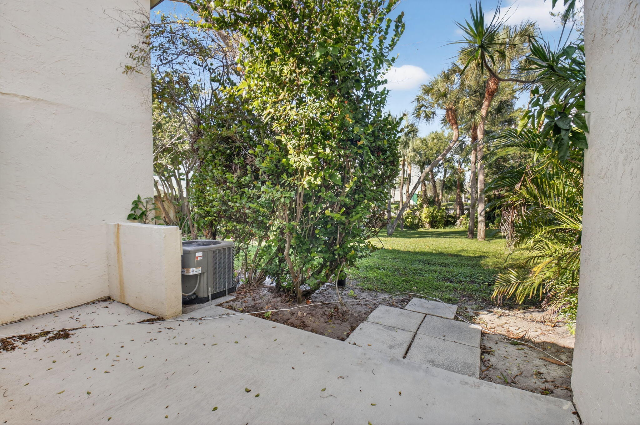 3143 Kingswood Terrace, Unit 3143 Boca Raton, FL 33431 - Photo 30 of 66 a view of a yard with plants and trees
