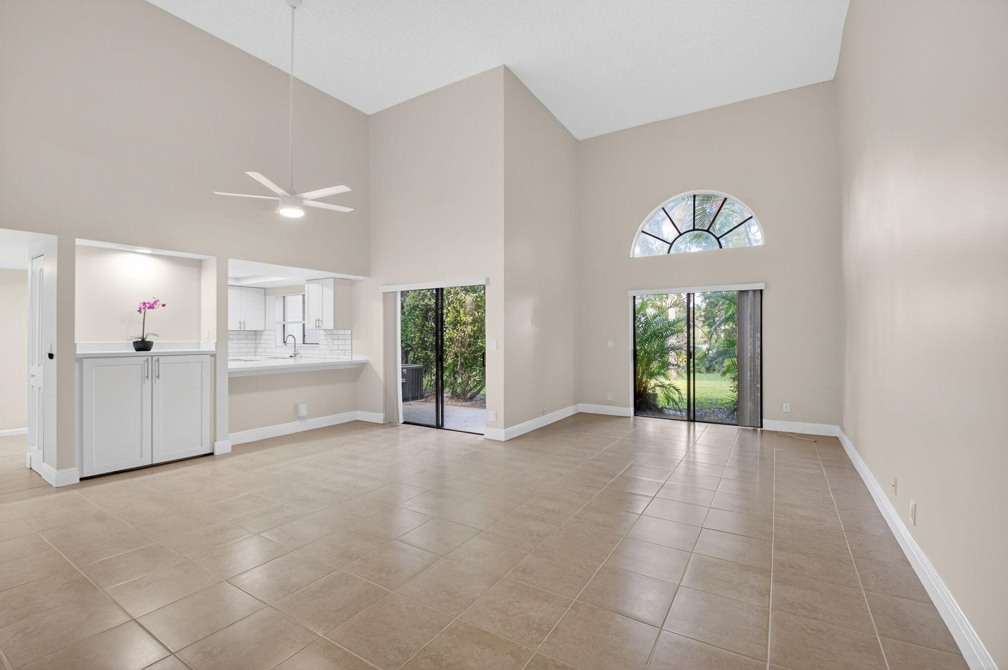 3143 Kingswood Terrace, Unit 3143 Boca Raton, FL 33431 - Photo 4 of 66 a view of a kitchen with a sink and a window