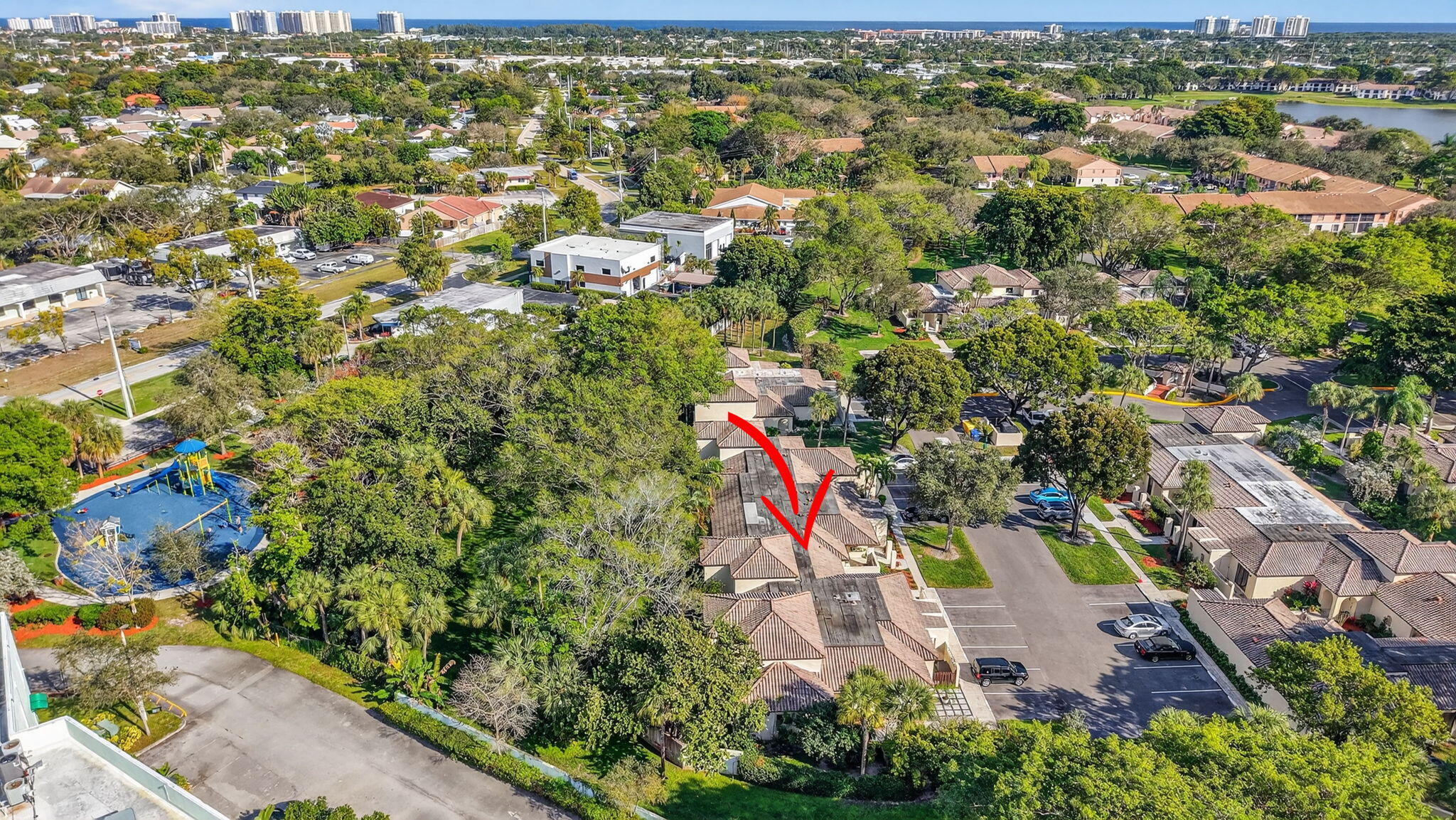 3143 Kingswood Terrace, Unit 3143 Boca Raton, FL 33431 - Photo 44 of 66 an aerial view of residential houses with outdoor space and trees