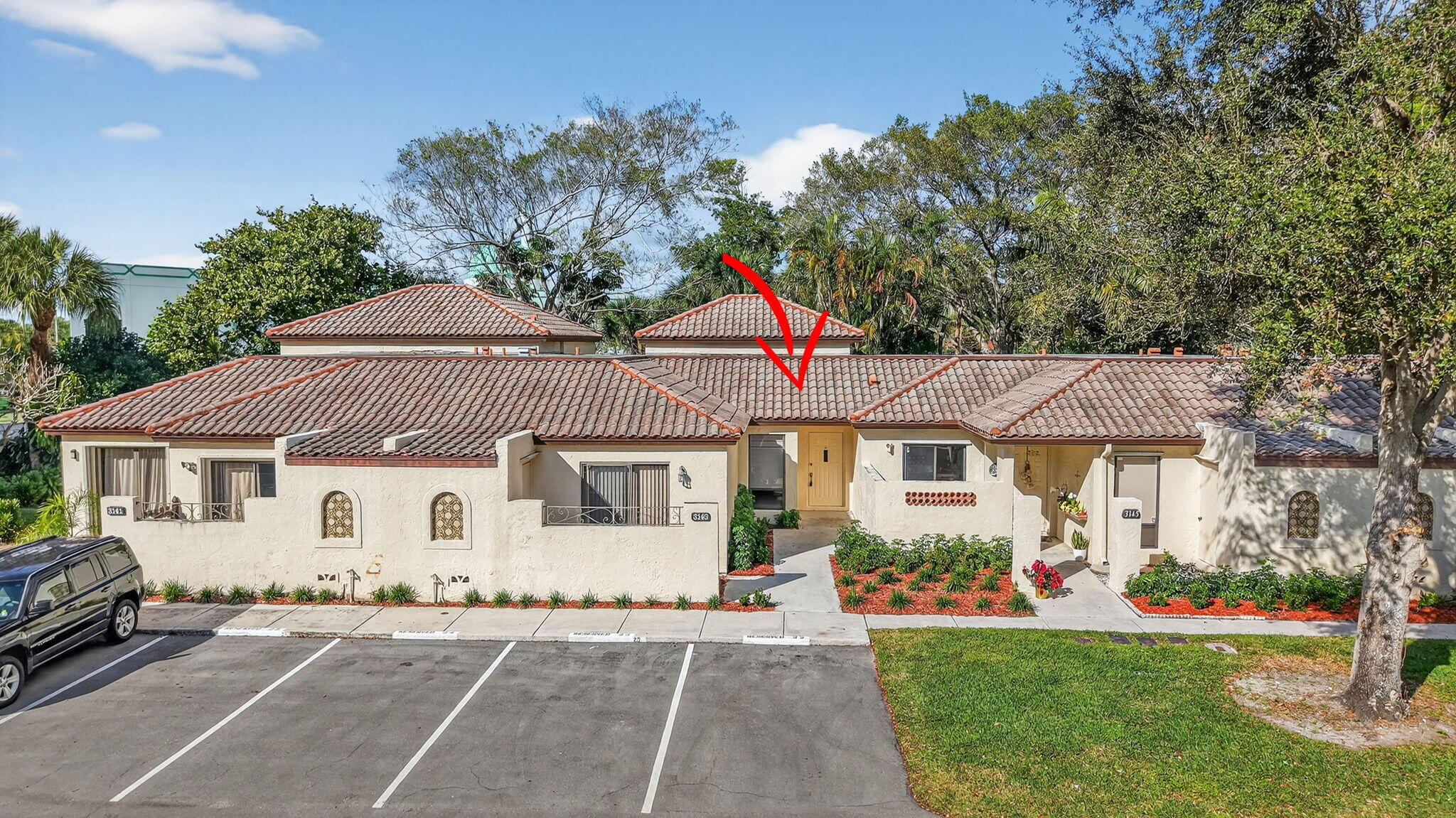 3143 Kingswood Terrace, Unit 3143 Boca Raton, FL 33431 - Photo 48 of 66 a front view of a house with a yard