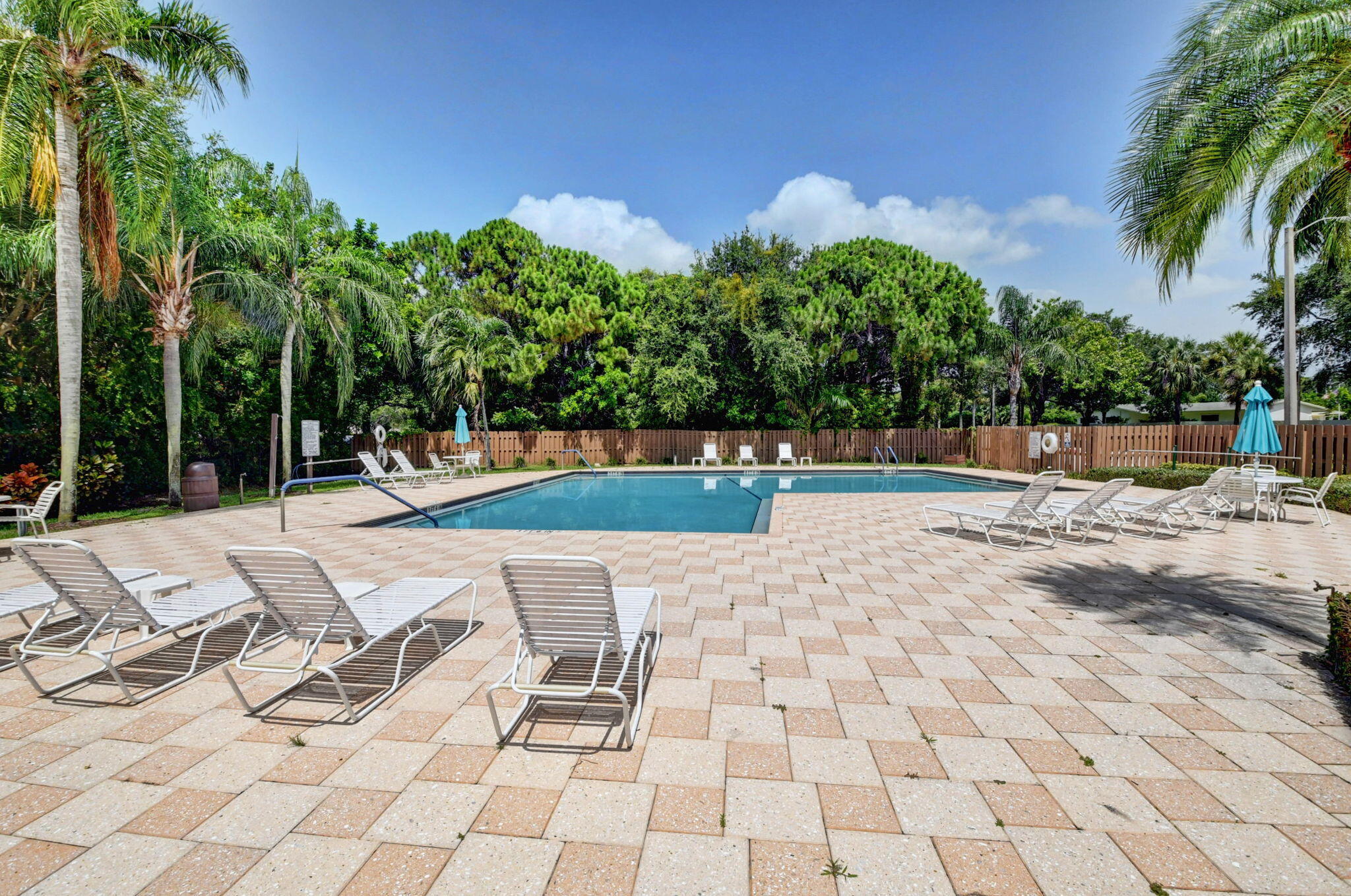 3143 Kingswood Terrace, Unit 3143 Boca Raton, FL 33431 - Photo 53 of 66 TROPICAL PATIO AT COMMUNITY POOL