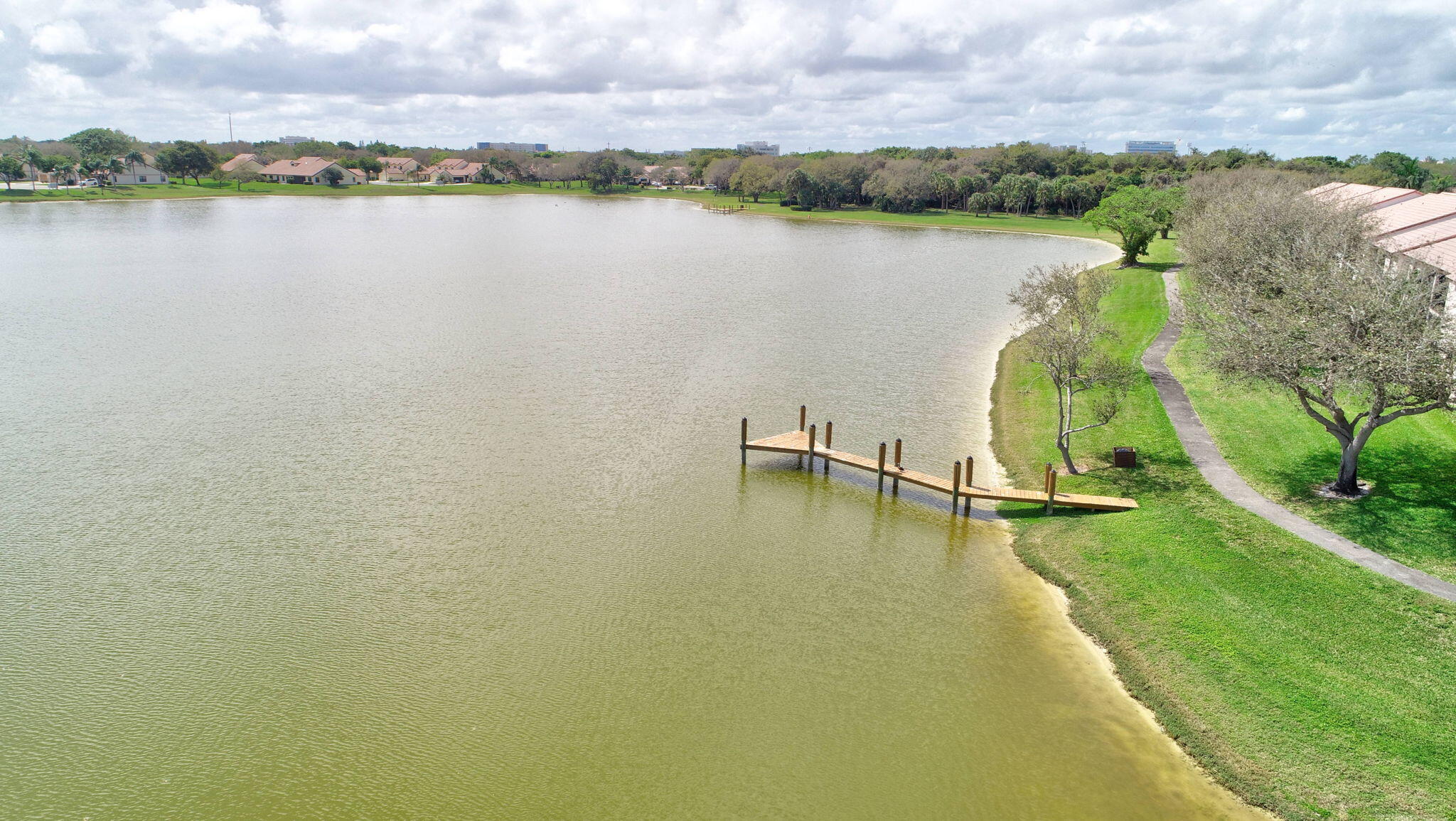 3143 Kingswood Terrace, Unit 3143 Boca Raton, FL 33431 - Photo 54 of 66 a view of a lake with houses in the back