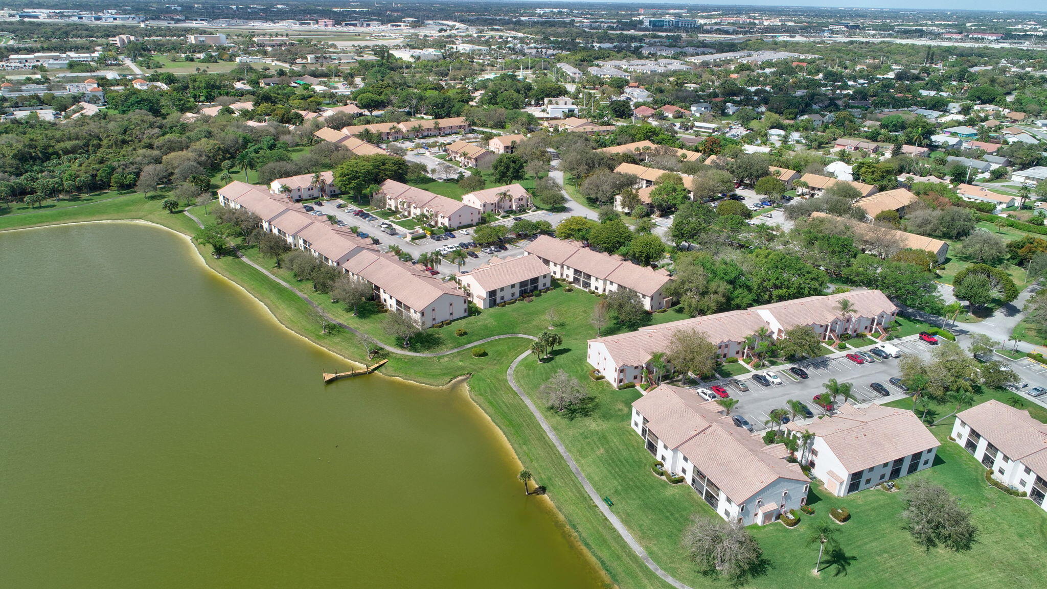3143 Kingswood Terrace, Unit 3143 Boca Raton, FL 33431 - Photo 55 of 66 an aerial view of residential houses with outdoor space and trees