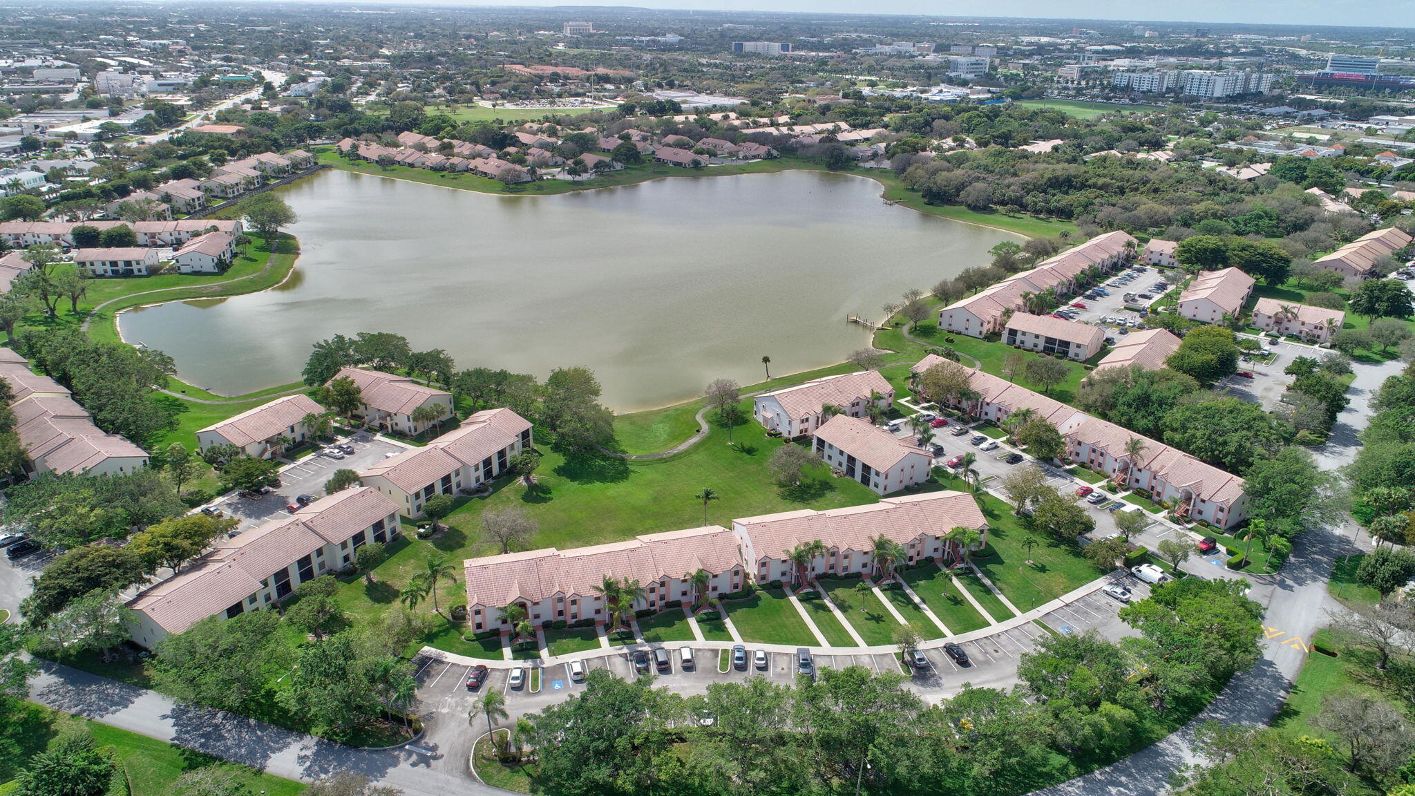 3143 Kingswood Terrace, Unit 3143 Boca Raton, FL 33431 - Photo 56 of 66 an aerial view of lake and residential houses with outdoor space