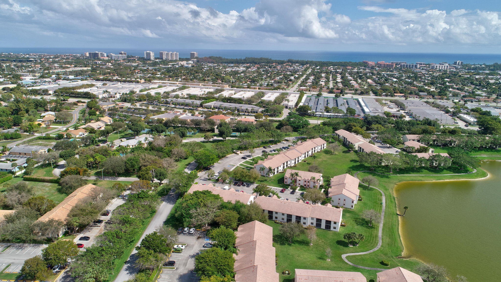 3143 Kingswood Terrace, Unit 3143 Boca Raton, FL 33431 - Photo 61 of 66 an aerial view of residential houses with outdoor space and lake view