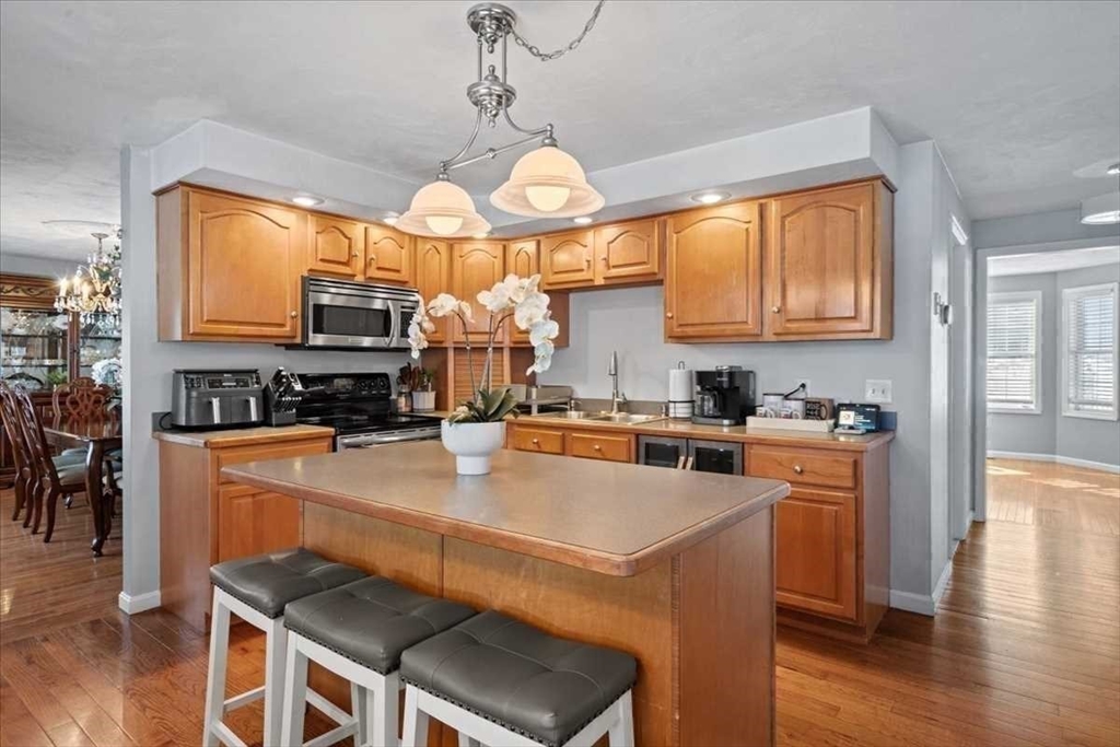 8 Wamsutta Ridge Road Charlton, MA 01507 - Photo 11 of 38 a kitchen with sink a stove and chairs
