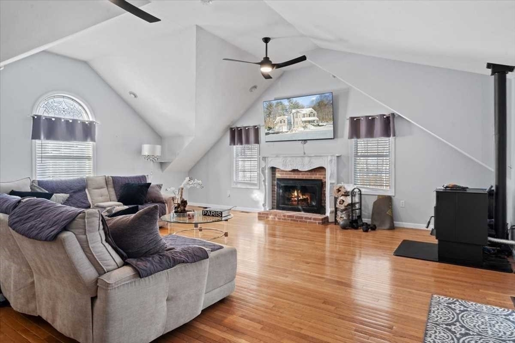 8 Wamsutta Ridge Road Charlton, MA 01507 - Photo 14 of 38 a living room with furniture and a fireplace