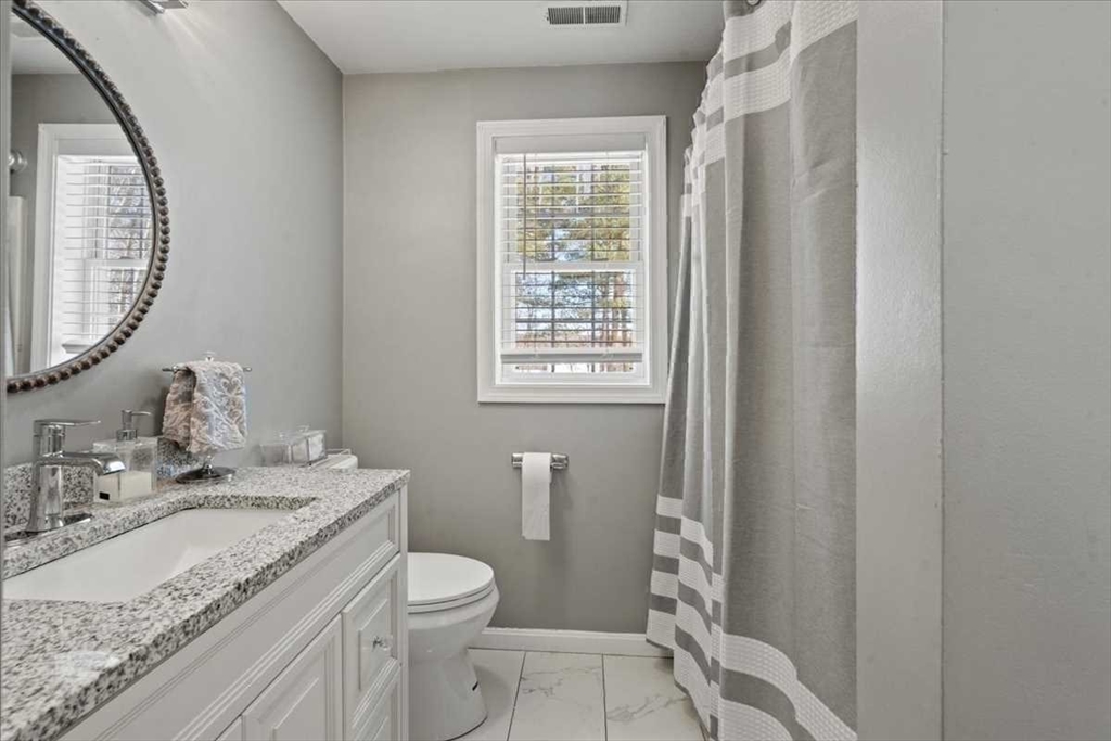 8 Wamsutta Ridge Road Charlton, MA 01507 - Photo 25 of 38 a bathroom with a granite countertop sink toilet and shower