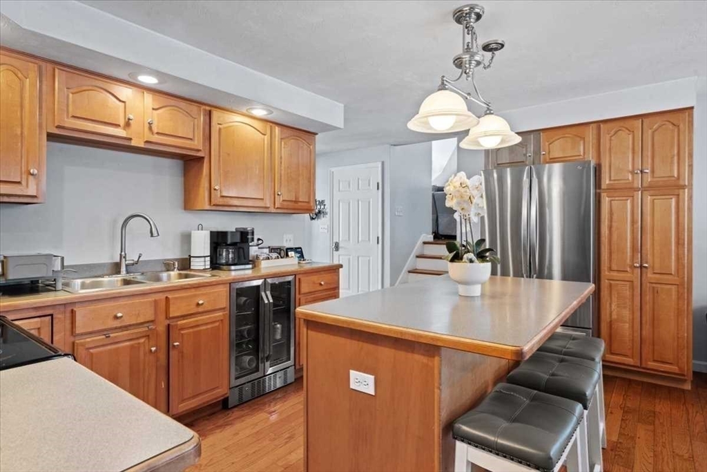 8 Wamsutta Ridge Road Charlton, MA 01507 - Photo 8 of 38 a kitchen with stainless steel appliances granite countertop a sink refrigerator and cabinets