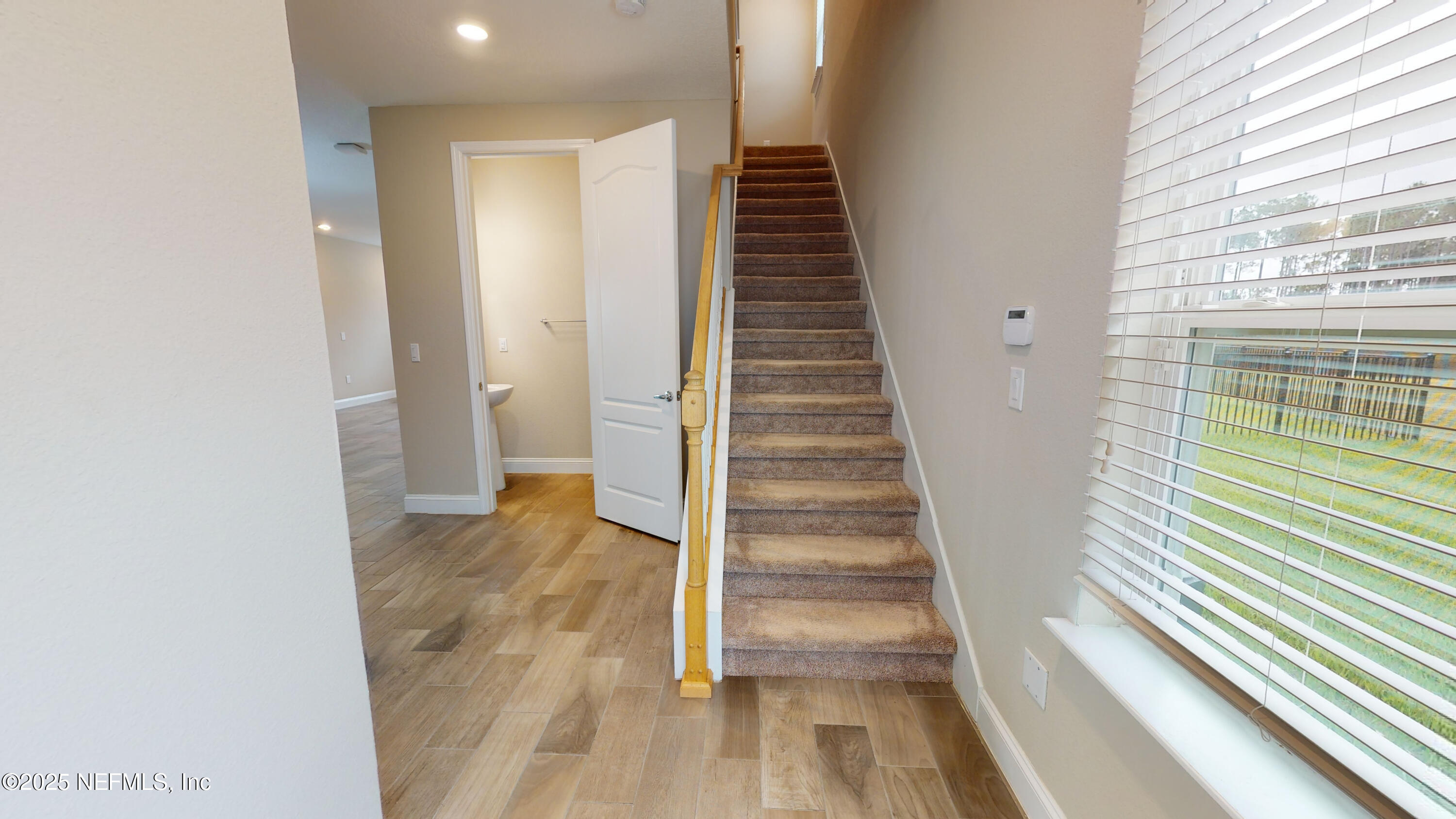 201 Silver Creek Place St. Augustine, FL 32095 - Photo 2 of 26 a view of entryway with wooden floor and stairs