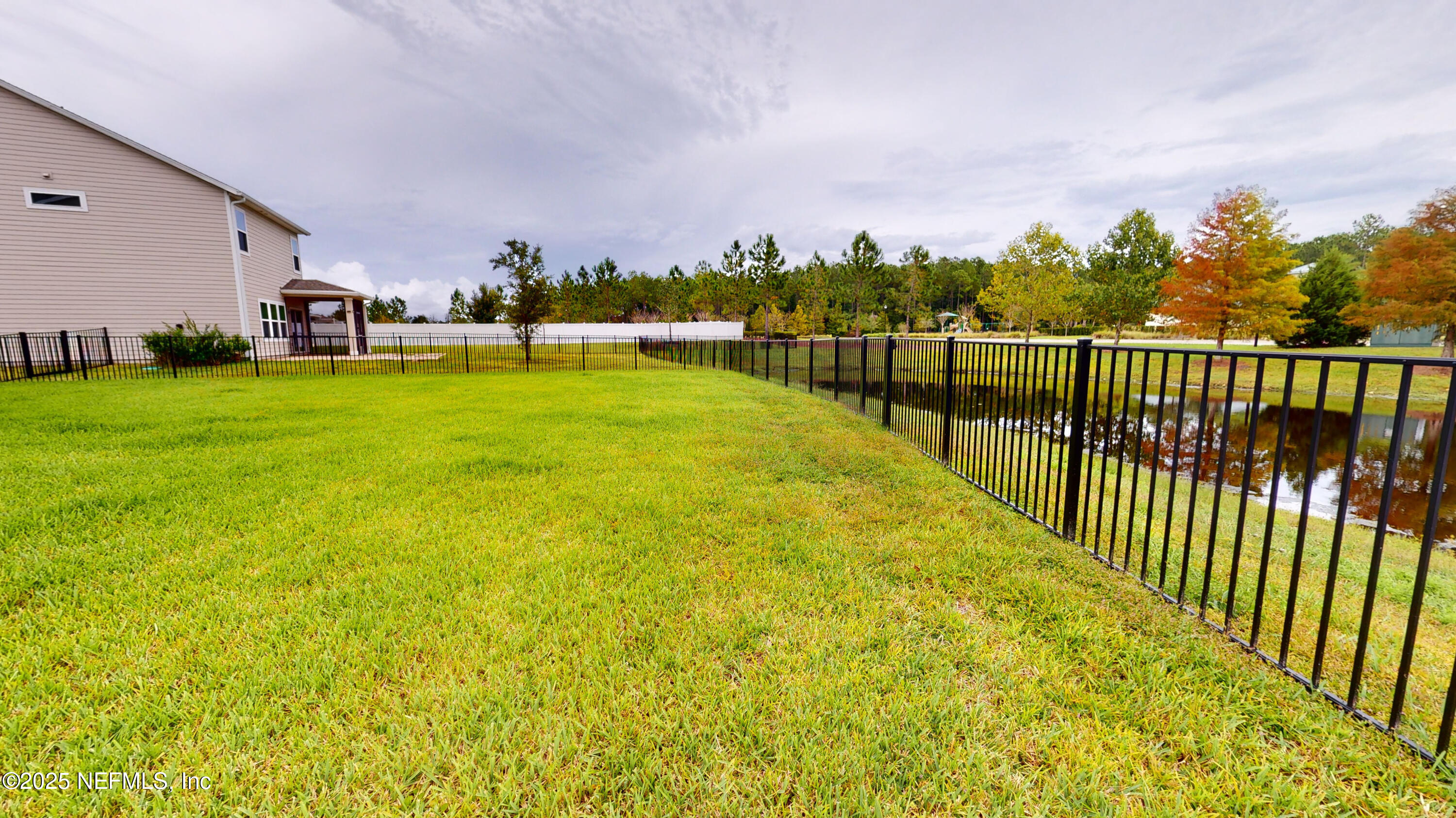201 Silver Creek Place St. Augustine, FL 32095 - Photo 25 of 26 a view of a swimming pool with a garden