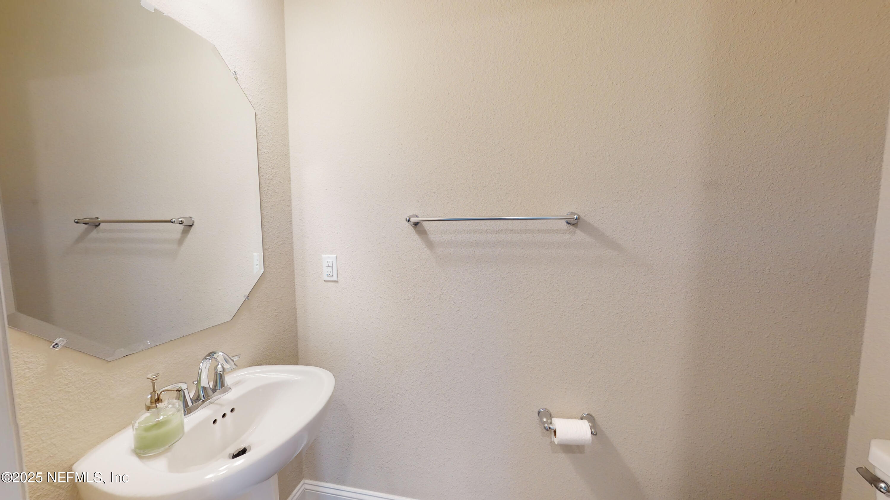 201 Silver Creek Place St. Augustine, FL 32095 - Photo 3 of 26 a bathroom with a sink and a mirror