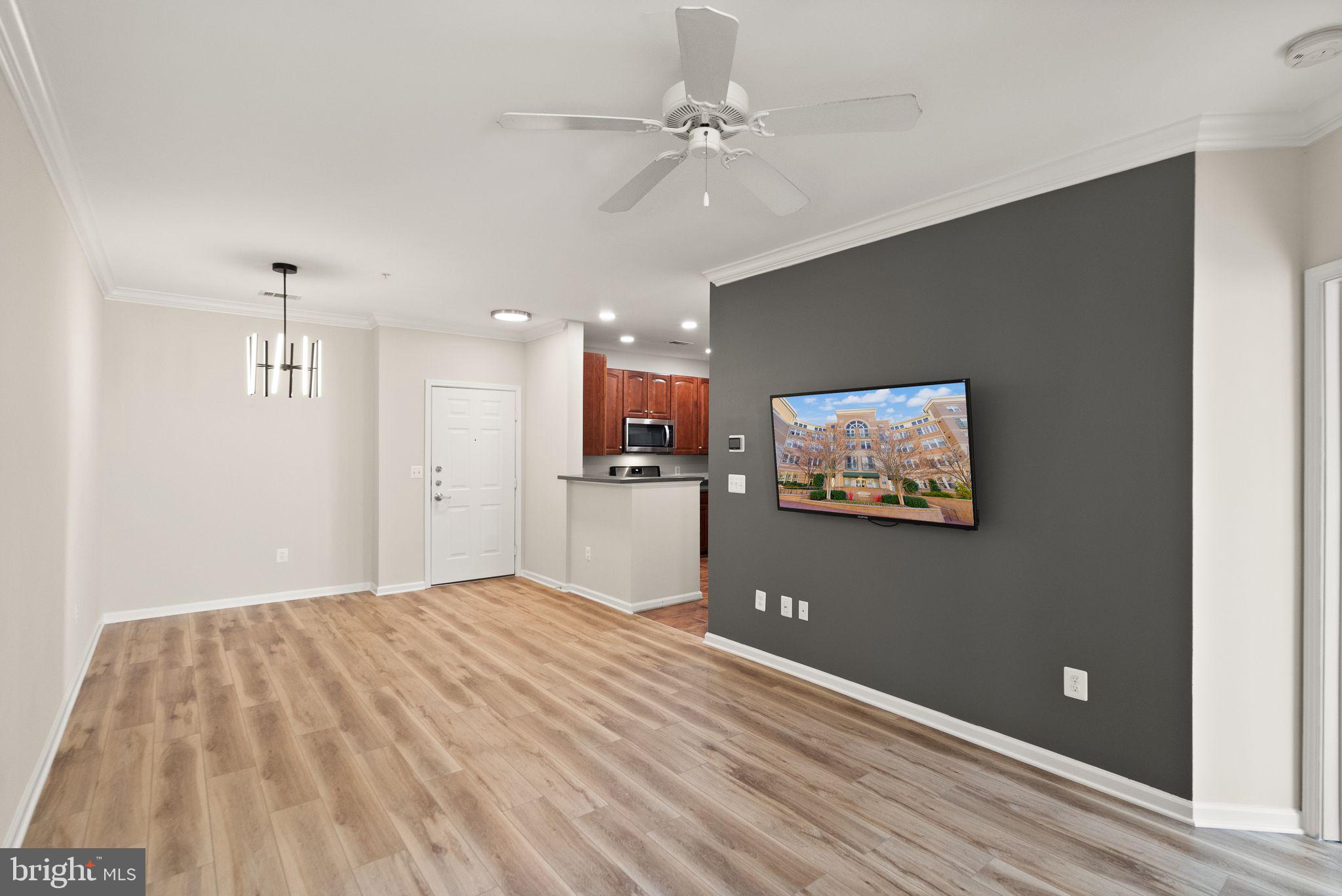 12001 Market Street, Unit 206 Reston, VA 20190 - Photo 13 of 25 a view of a livingroom with a flat screen tv