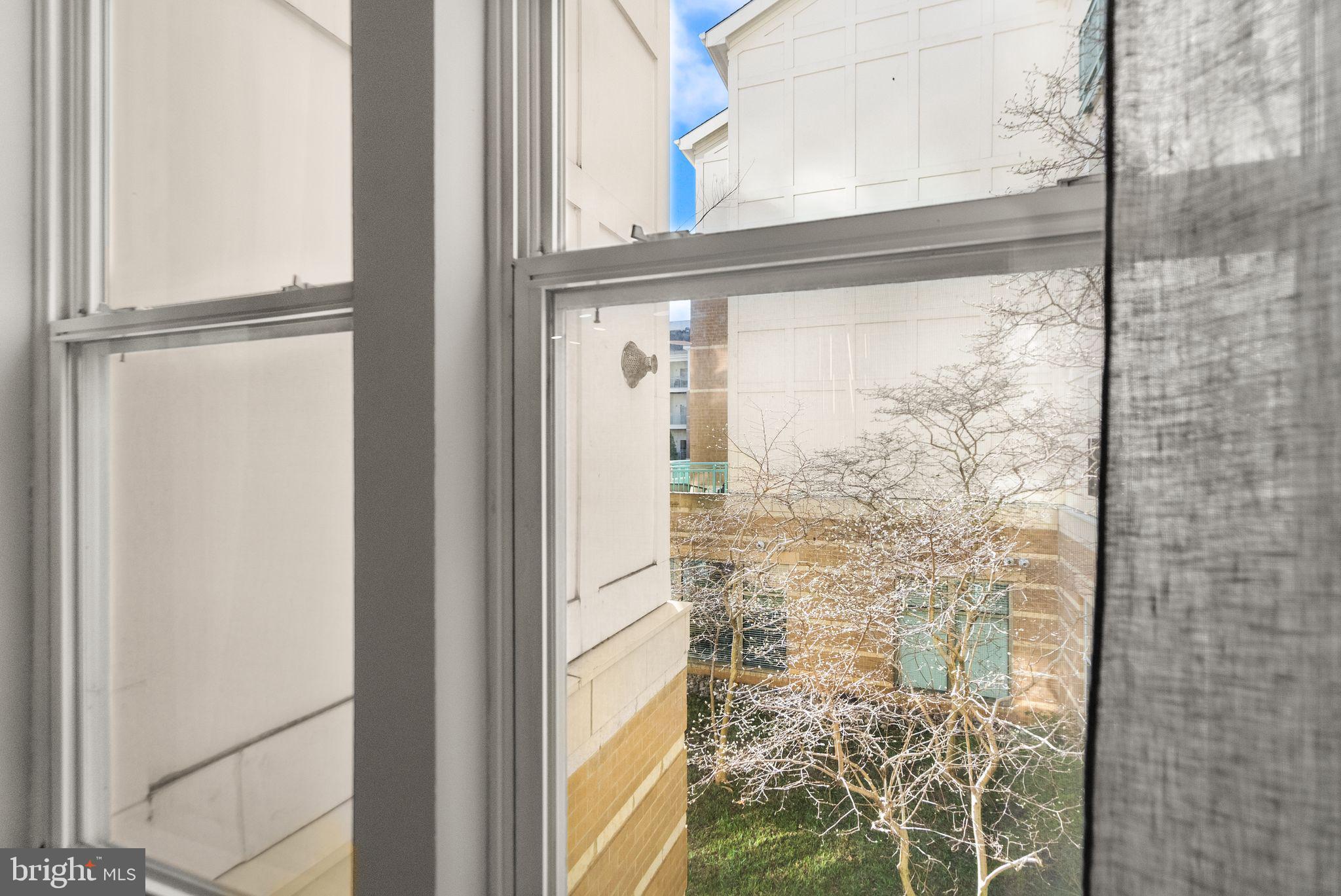 12001 Market Street, Unit 206 Reston, VA 20190 - Photo 14 of 25 a bathroom with a shower
