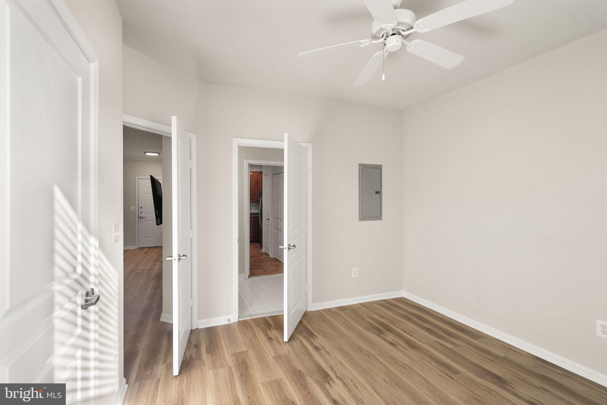 12001 Market Street, Unit 206 Reston, VA 20190 - Photo 16 of 25 wooden floor in an empty room