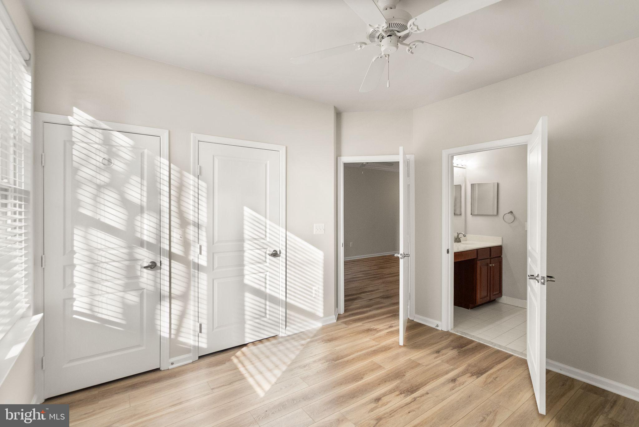 12001 Market Street, Unit 206 Reston, VA 20190 - Photo 17 of 25 a view of an empty room with cabinet and a bathroom