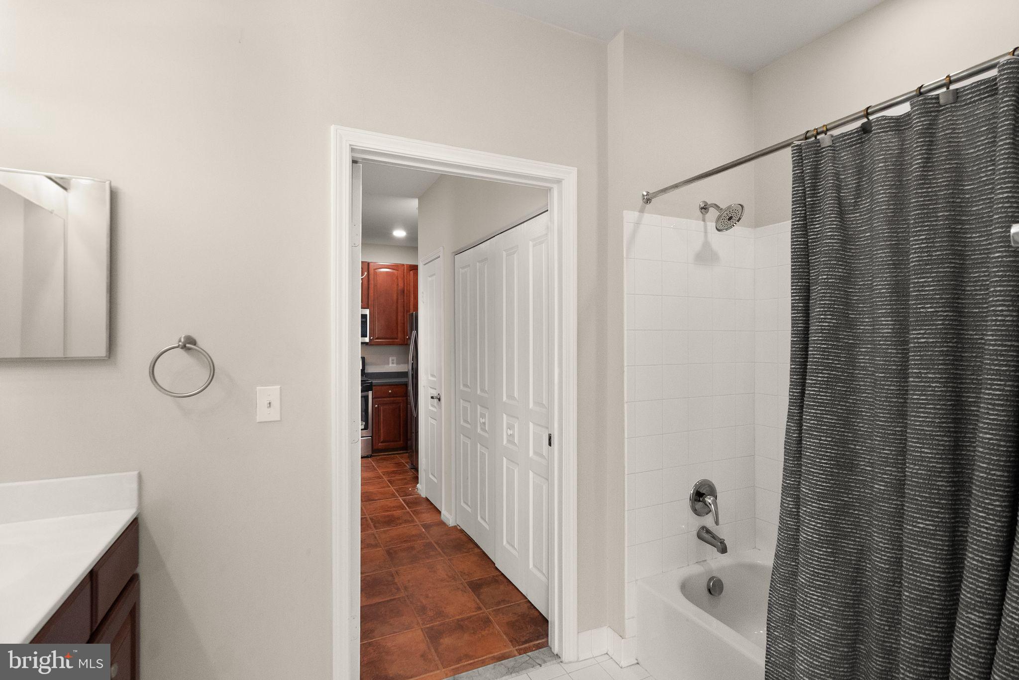 12001 Market Street, Unit 206 Reston, VA 20190 - Photo 19 of 25 a view of a bathroom from the hallway