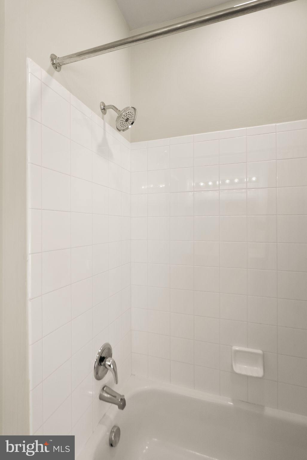 12001 Market Street, Unit 206 Reston, VA 20190 - Photo 22 of 25 a bathroom with a shower