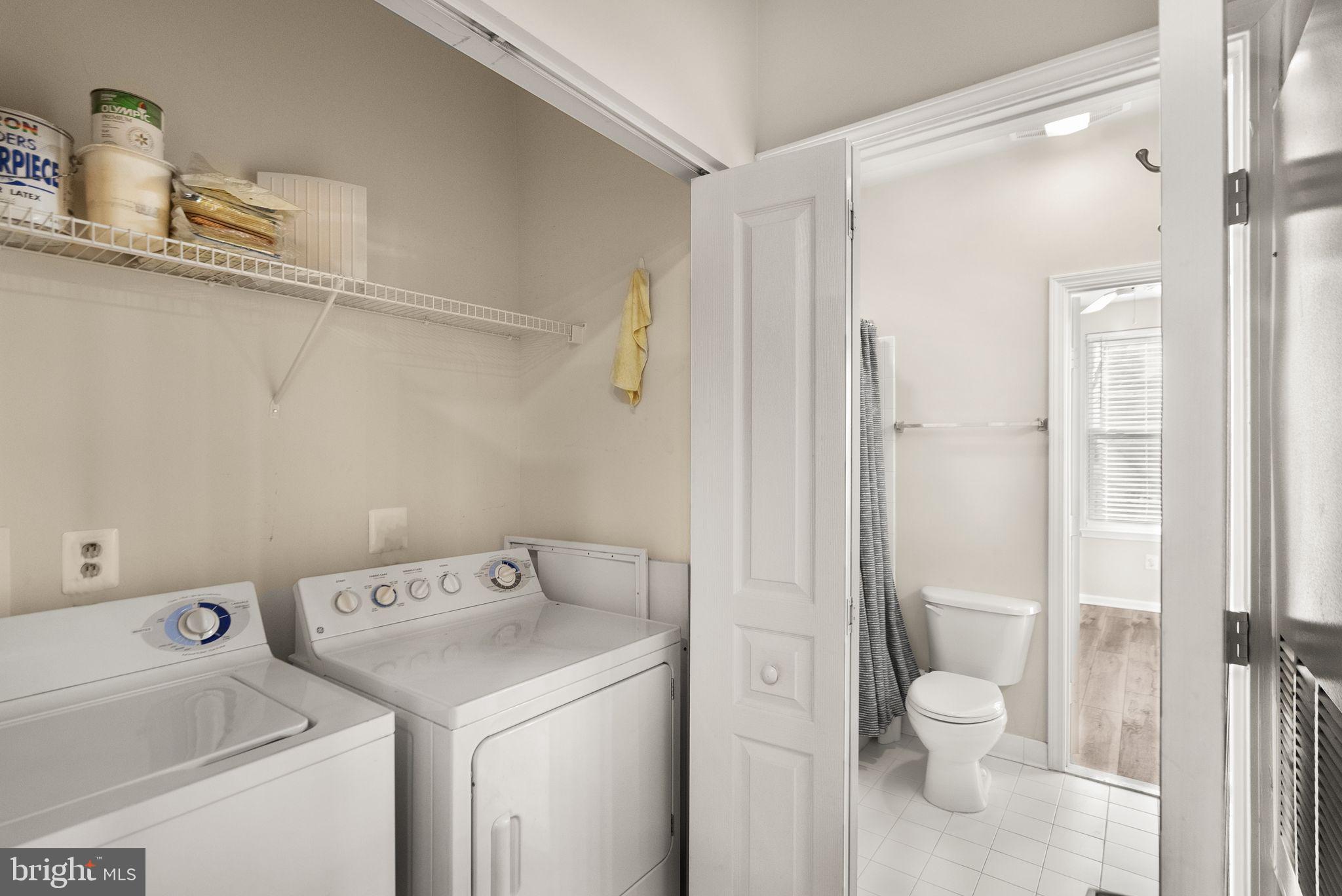 12001 Market Street, Unit 206 Reston, VA 20190 - Photo 24 of 25 a view of bathroom with a washer and dryer