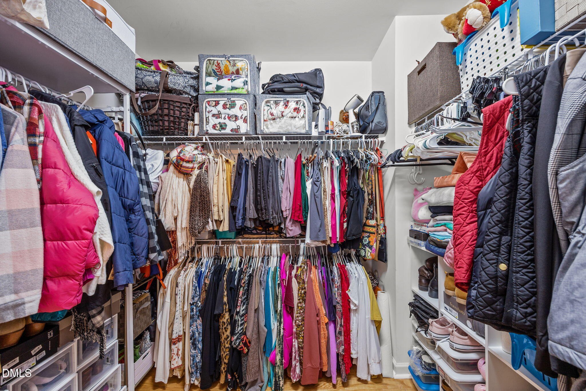 1511 Brambleton Court Graham, NC 27253 - Photo 19 of 43 a view of walk in closet with clothes