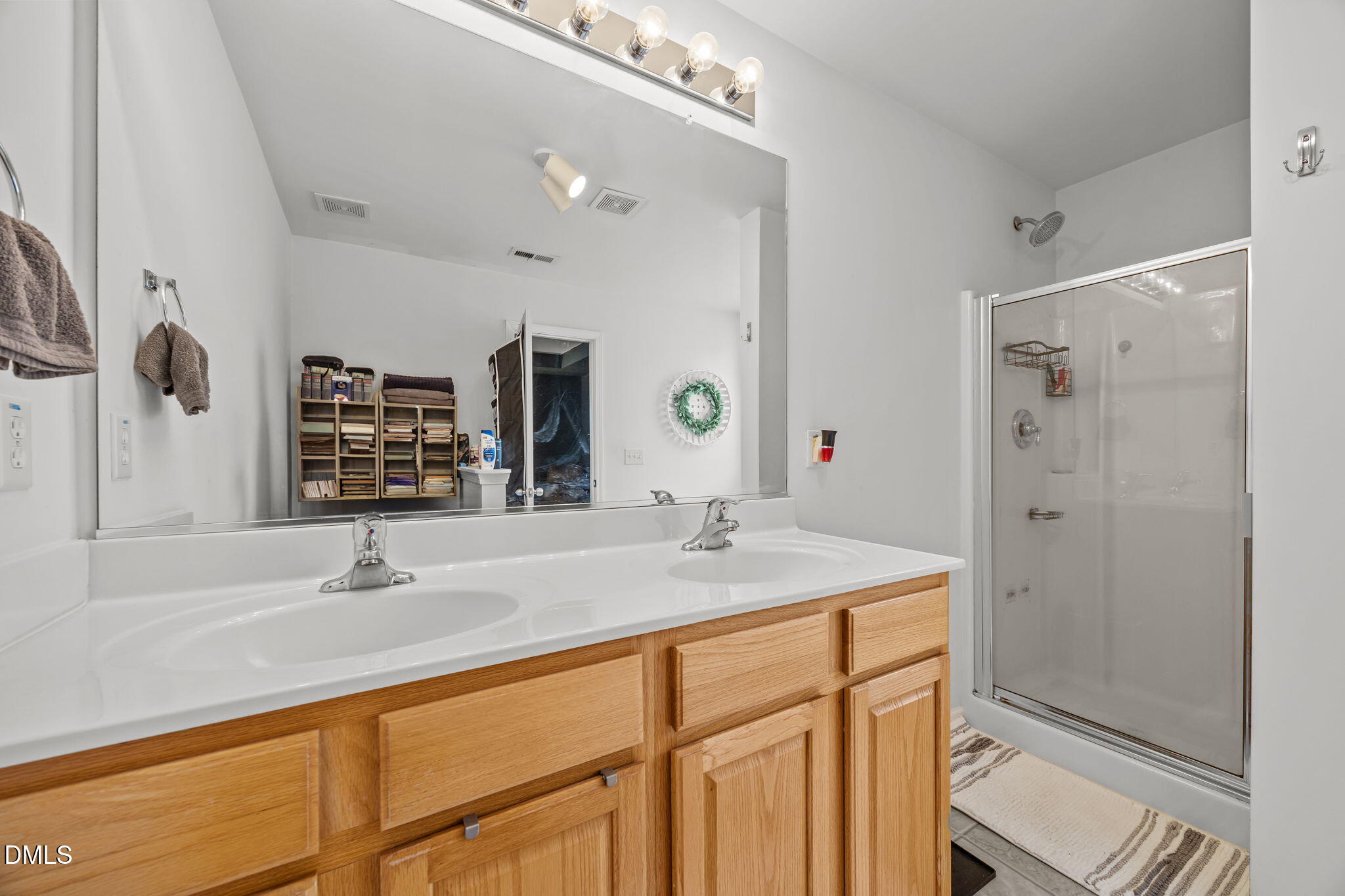 1511 Brambleton Court Graham, NC 27253 - Photo 21 of 43 a bathroom with a sink and a mirror