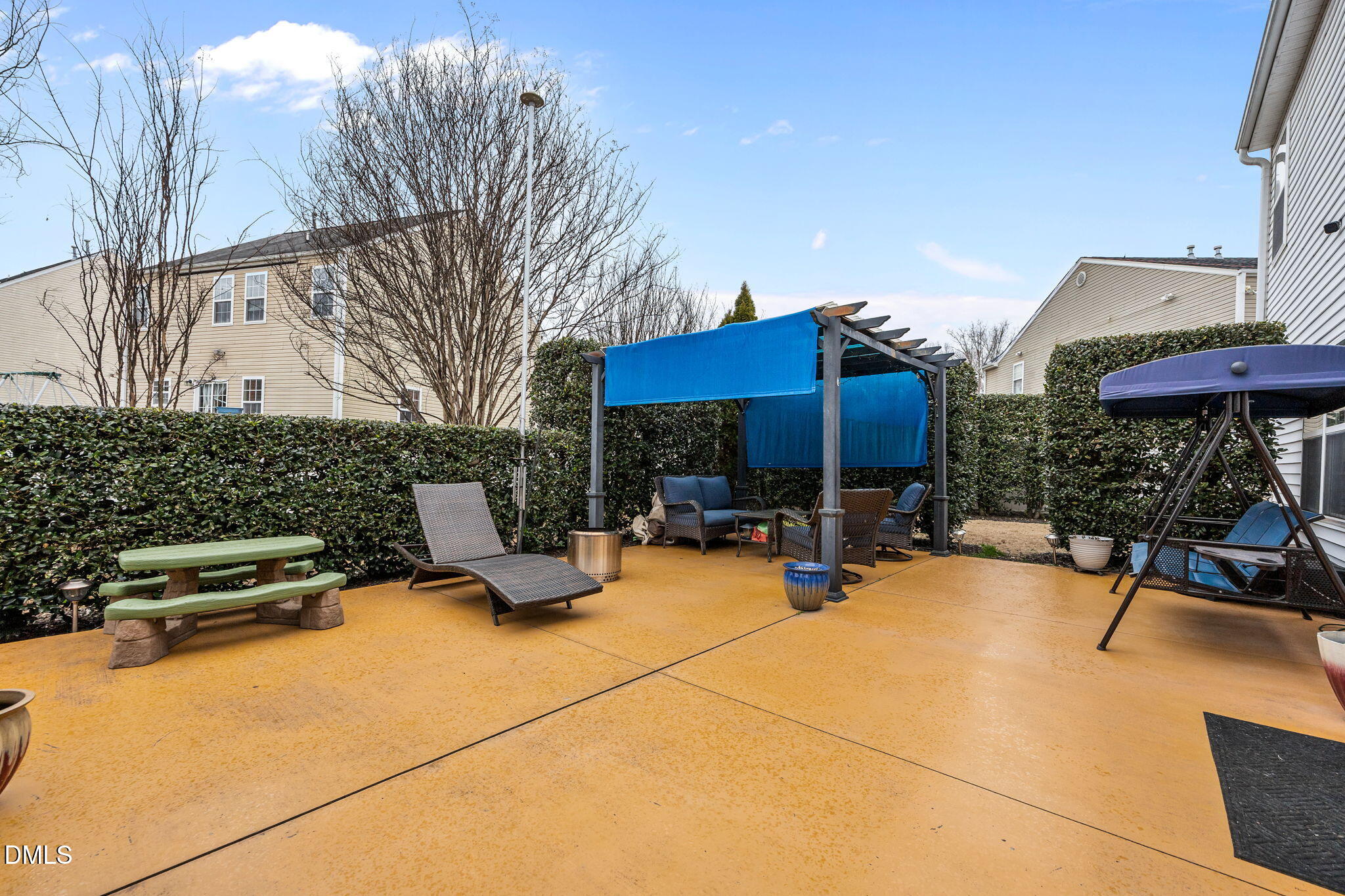 1511 Brambleton Court Graham, NC 27253 - Photo 32 of 43 a view of a patio with dining table and chairs under an umbrella