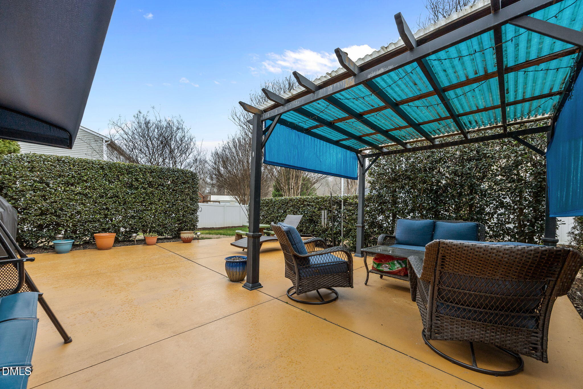 1511 Brambleton Court Graham, NC 27253 - Photo 33 of 43 a view of patio with a table and chairs under an umbrella with a small yard