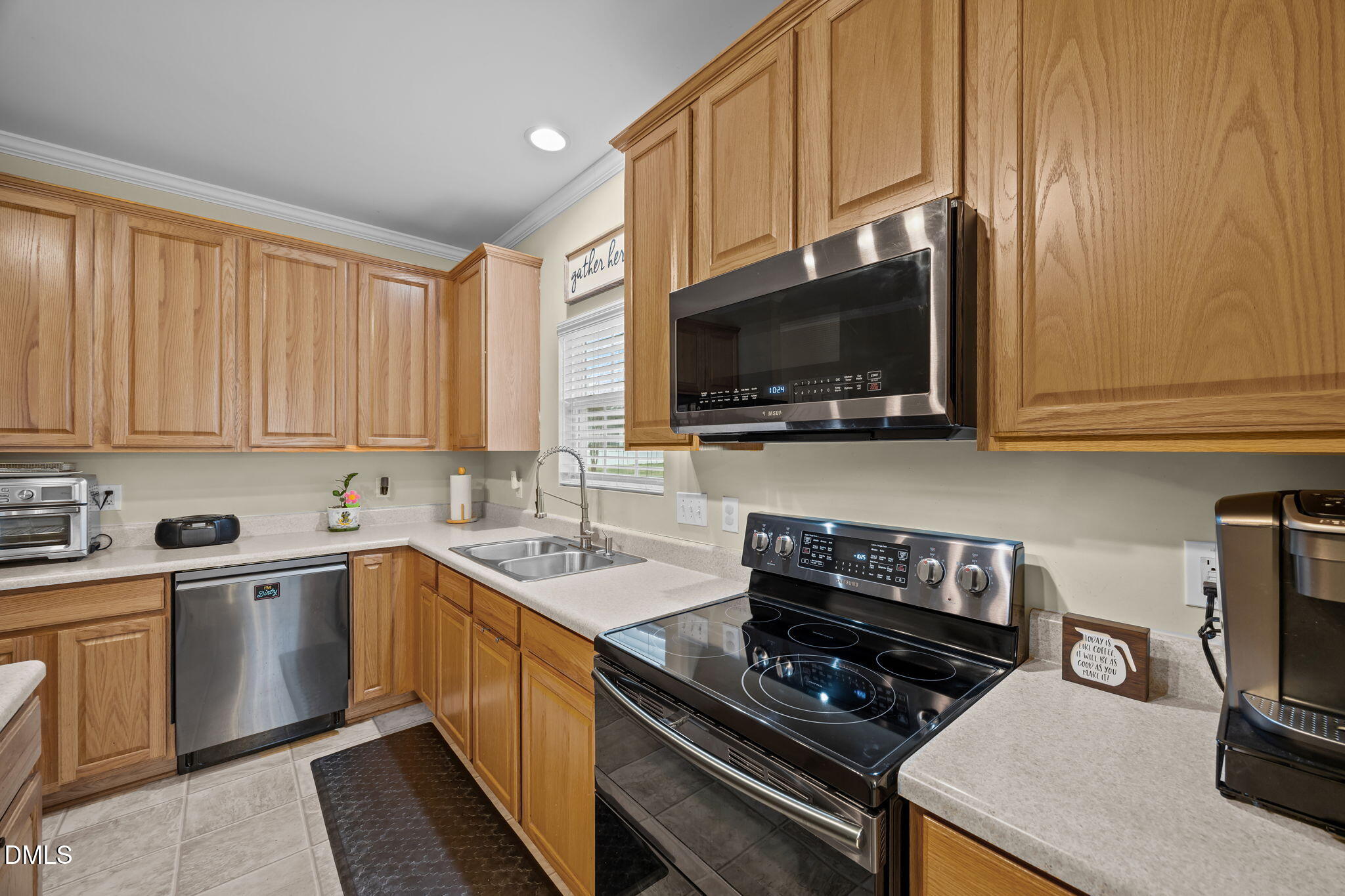 1511 Brambleton Court Graham, NC 27253 - Photo 9 of 43 a kitchen with a sink a stove and cabinets