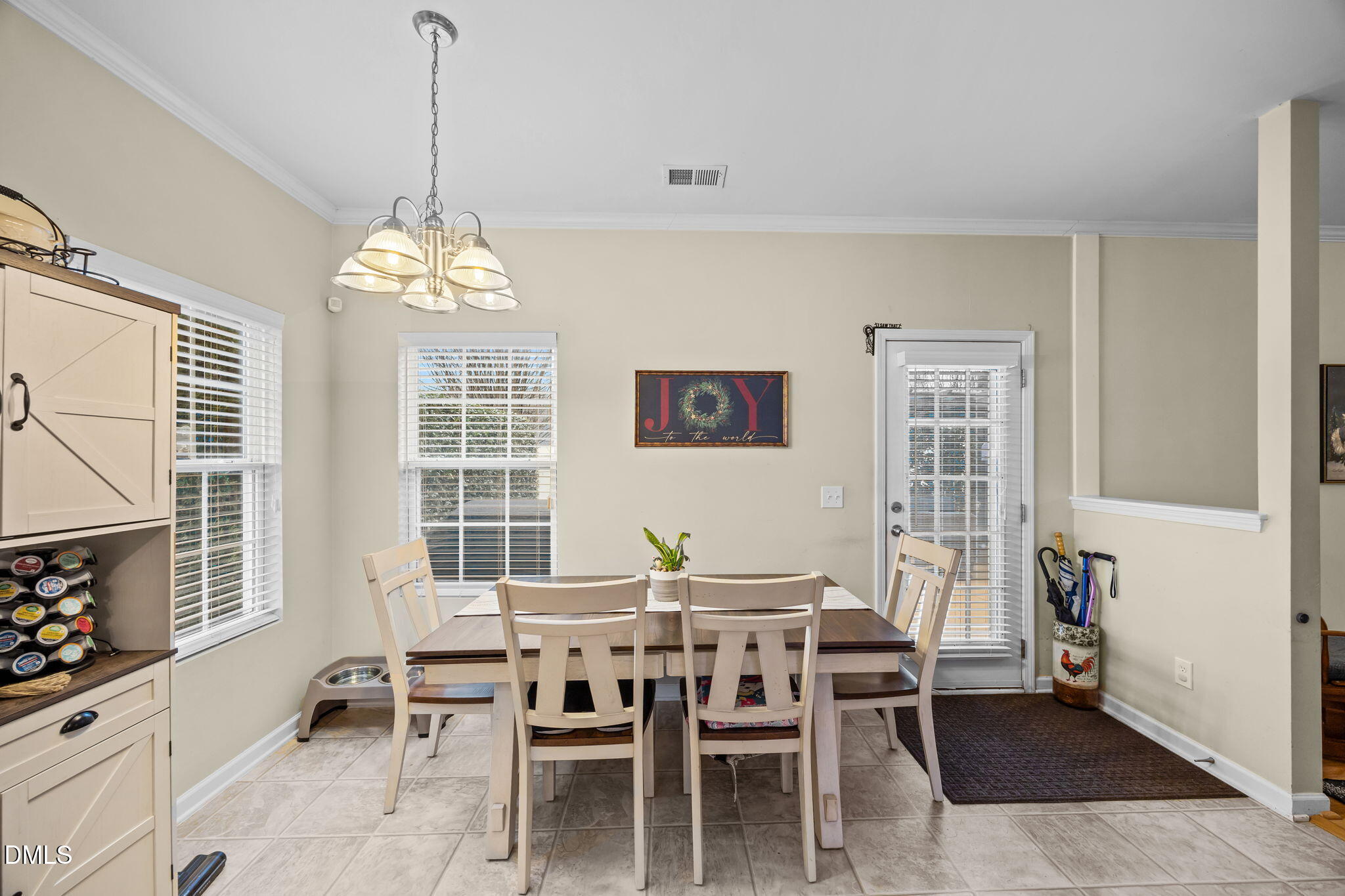 1511 Brambleton Court Graham, NC 27253 - Photo 10 of 43 a dining room with furniture a chandelier and window
