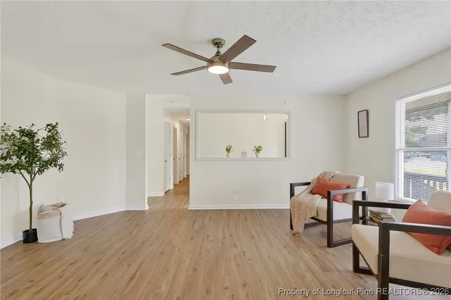 a workspace with furniture window and wooden floor
