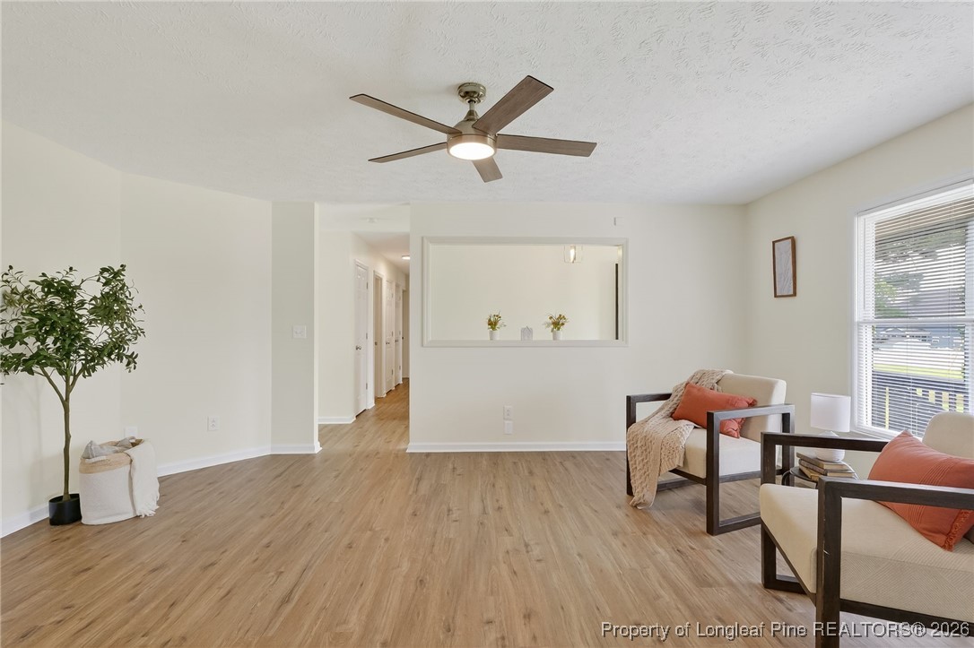 6250 Waldos Beach Road Fayetteville, NC 28306 - Photo 12 of 50 a workspace with furniture window and wooden floor
