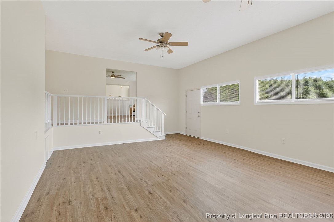 6250 Waldos Beach Road Fayetteville, NC 28306 - Photo 15 of 50 a view of an empty room with a window and wooden floor