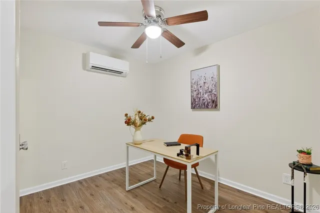 a workspace with furniture and wooden floor