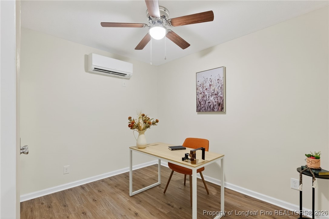 6250 Waldos Beach Road Fayetteville, NC 28306 - Photo 18 of 50 a workspace with furniture and wooden floor
