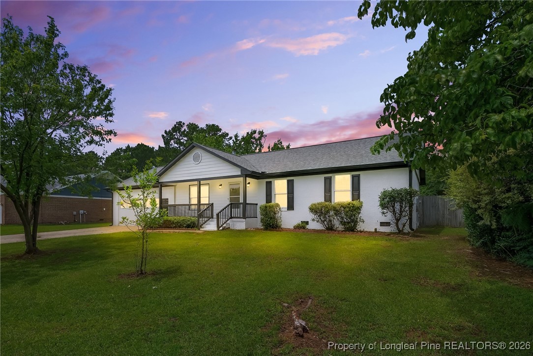 6250 Waldos Beach Road Fayetteville, NC 28306 - Photo 2 of 50 a front view of a house with a yard and garage