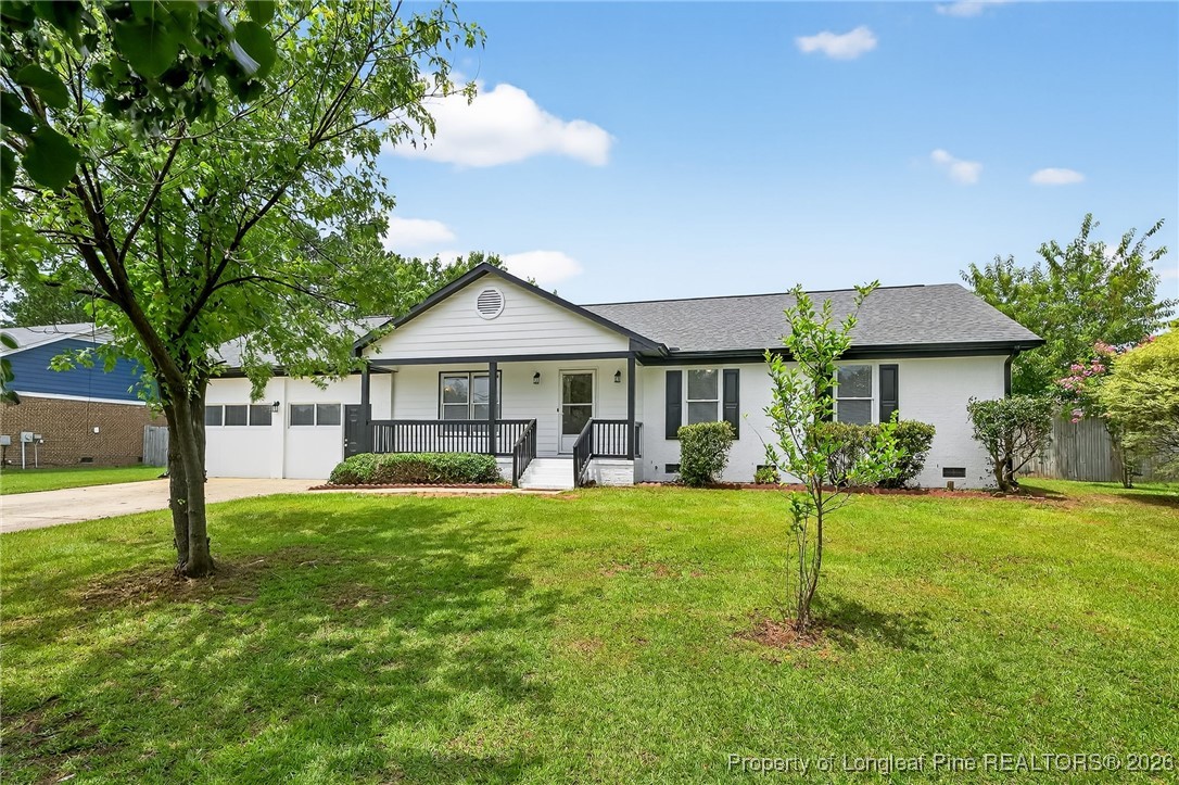 6250 Waldos Beach Road Fayetteville, NC 28306 - Photo 3 of 50 a front view of a house with a yard and trees