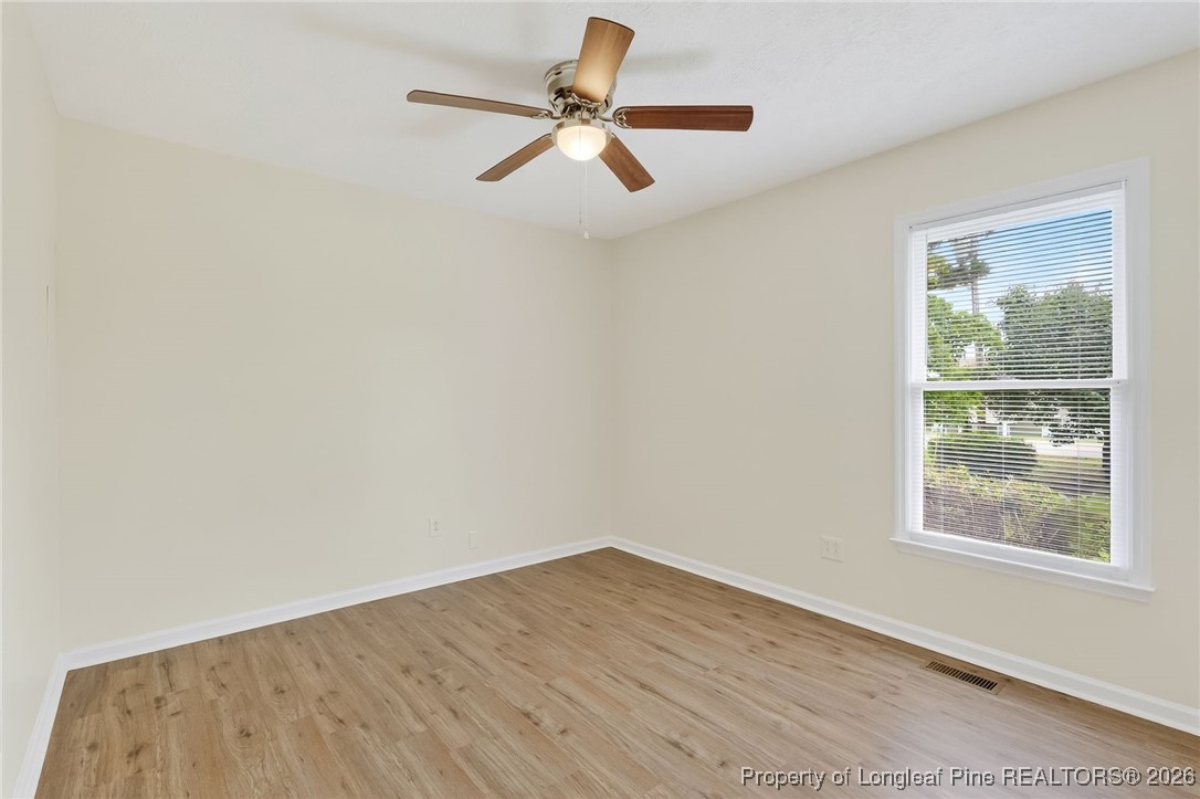 6250 Waldos Beach Road Fayetteville, NC 28306 - Photo 34 of 50 a view of empty room with wooden floor and fan