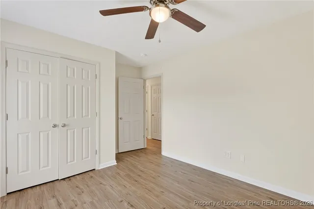 a view of an empty room and wooden floor