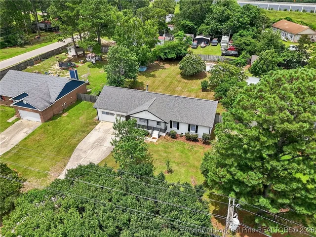 an aerial view of house with yard